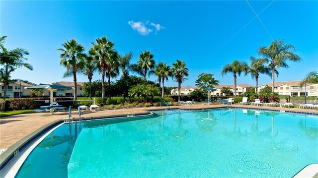 pool featuring a residential view and fence