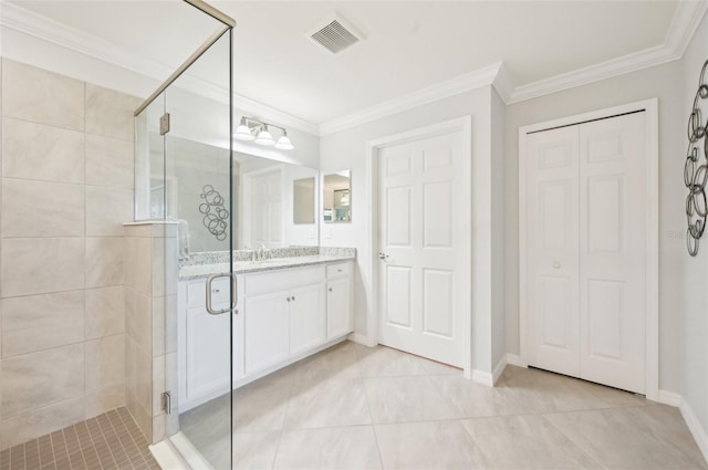 bathroom featuring visible vents, ornamental molding, a shower stall, vanity, and baseboards