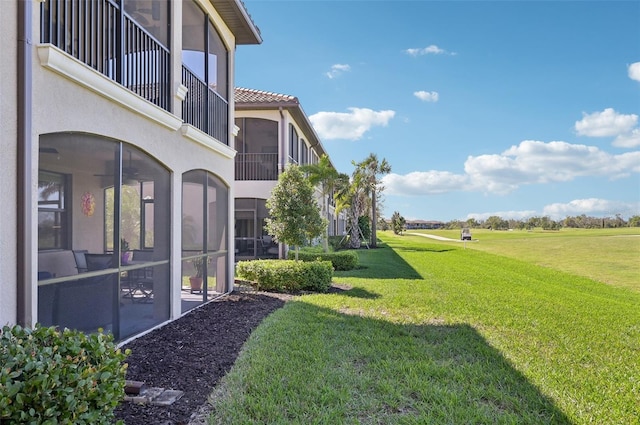 view of yard with a sunroom