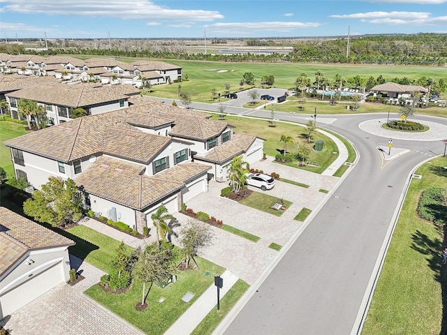 birds eye view of property featuring view of golf course and a residential view