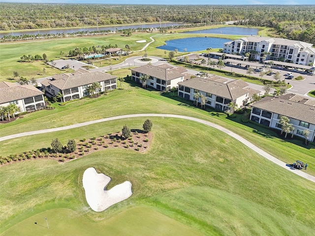 aerial view featuring golf course view and a water view