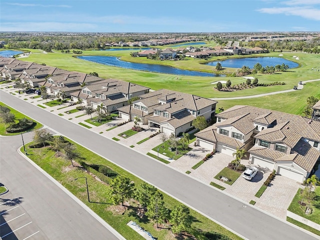 birds eye view of property featuring view of golf course and a residential view