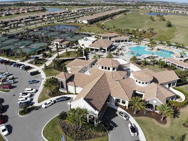 bird's eye view with a water view and a residential view