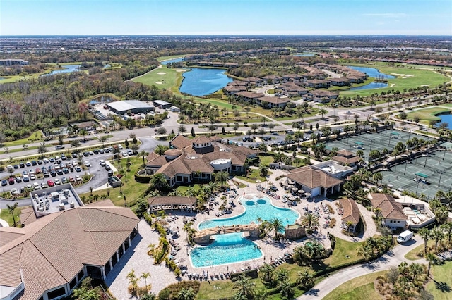 aerial view featuring a water view and golf course view