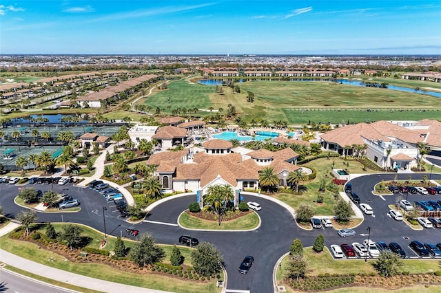 bird's eye view featuring view of golf course, a water view, and a residential view