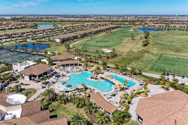 drone / aerial view featuring a water view and golf course view