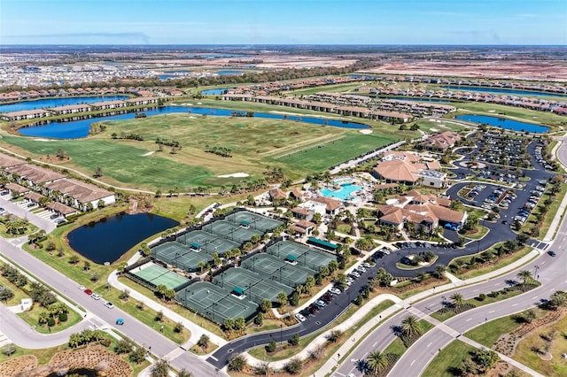 birds eye view of property with a water view