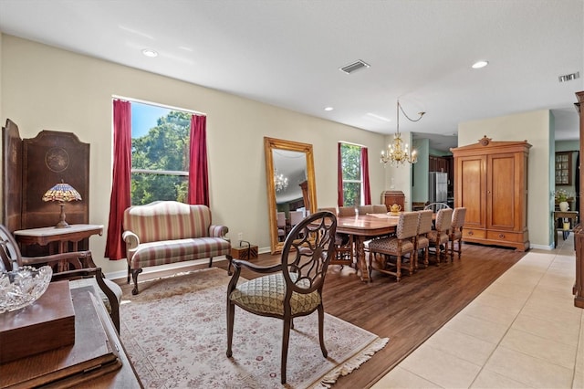 6156 41st St E, Bradenton, FL 34203 - living area with a chandelier, recessed lighting, and light wood-style flooring