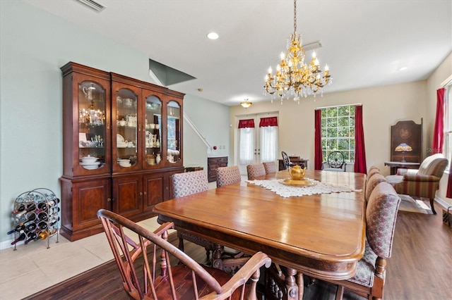 6156 41st St E, Bradenton, FL 34203 - dining area with a chandelier, wood finished floors, and recessed lighting