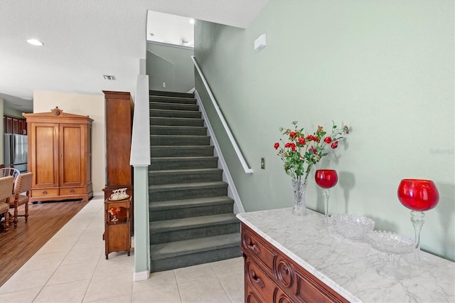 6156 41st St E, Bradenton, FL 34203 - staircase featuring tile patterned floors and recessed lighting