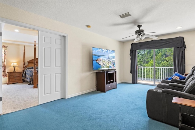 6156 41st St E, Bradenton, FL 34203 - carpeted living area featuring ceiling fan and a textured ceiling