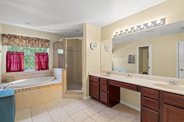 6156 41st St E, Bradenton, FL 34203 - bathroom featuring tile patterned floors, a garden tub, double vanity, and a stall shower