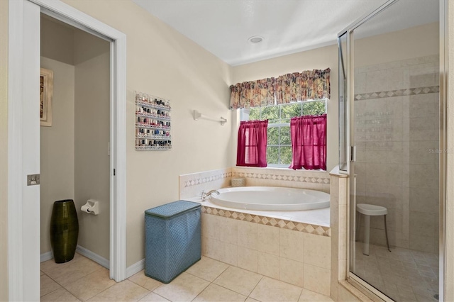 6156 41st St E, Bradenton, FL 34203 - full bath featuring tile patterned flooring, a garden tub, and a shower stall