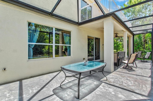 6156 41st St E, Bradenton, FL 34203 - view of patio / terrace featuring ceiling fan and glass enclosure