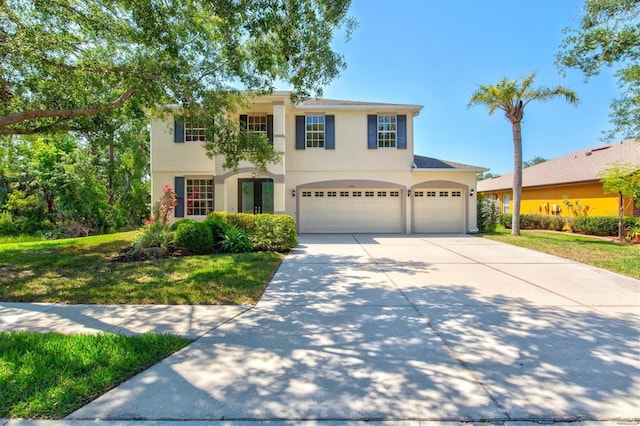 6156 41st St E, Bradenton, FL 34203 - view of front facade featuring stucco siding, concrete driveway, a garage, and a front yard