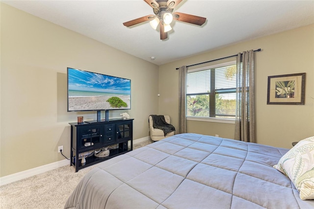 bedroom featuring carpet floors, baseboards, and a ceiling fan