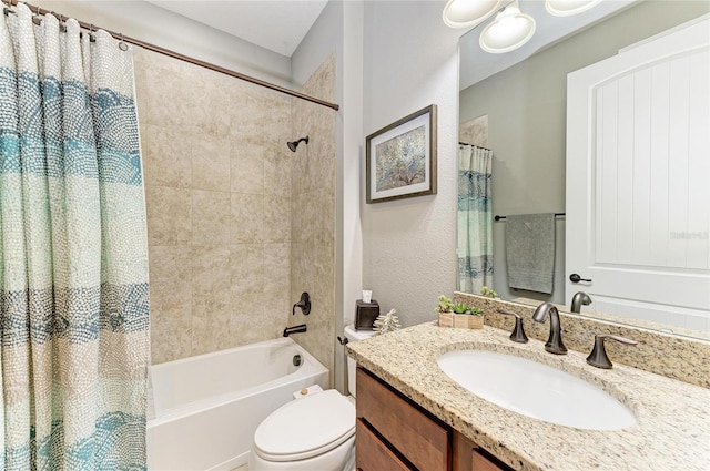 bathroom featuring shower / bath combo, vanity, and toilet