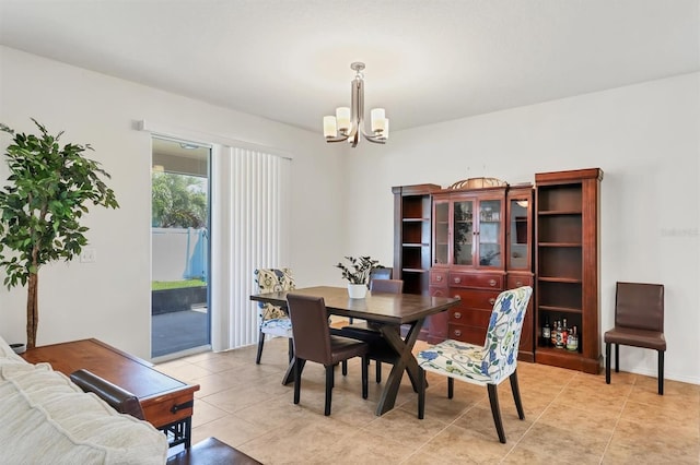 dining room featuring an inviting chandelier and light tile patterned floors