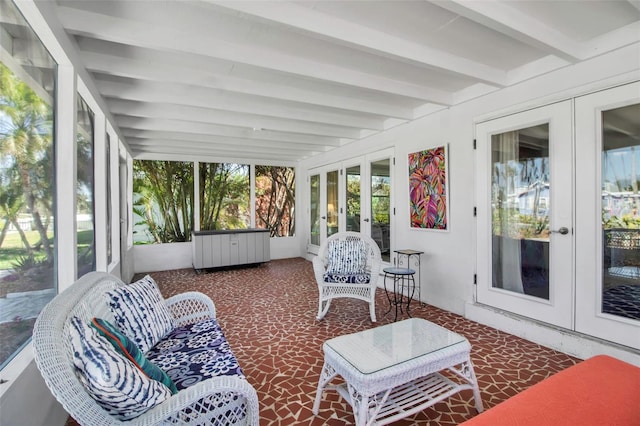 sunroom / solarium featuring french doors and beamed ceiling