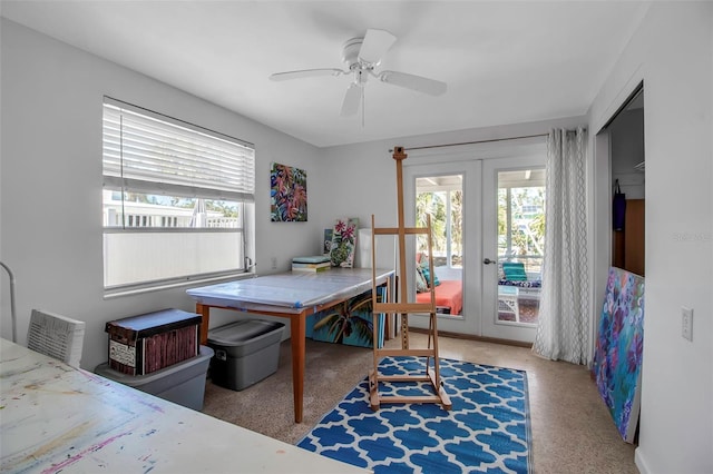 interior space with ceiling fan and french doors