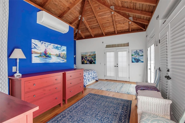 interior space featuring beam ceiling, french doors, wood finished floors, wooden ceiling, and a wall mounted air conditioner