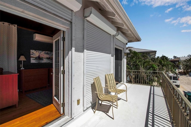 balcony featuring a wall mounted AC