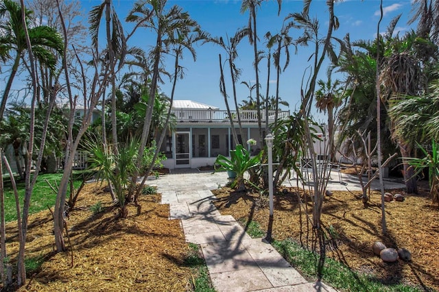 exterior space featuring a sunroom