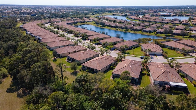 aerial view featuring a residential view and a water view