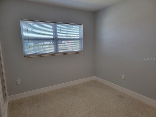 empty room featuring baseboards