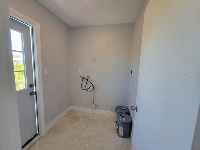 laundry room featuring hookup for a washing machine and baseboards