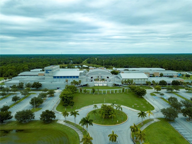 birds eye view of property with a view of trees