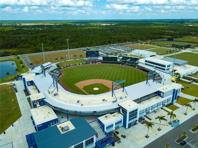 birds eye view of property with a forest view