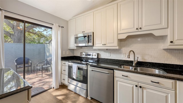 kitchen featuring a sink, white cabinets, and stainless steel appliances