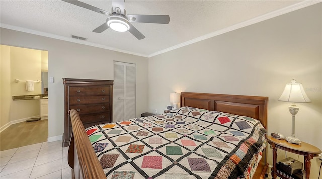 bedroom featuring visible vents, a textured ceiling, a closet, crown molding, and light tile patterned floors