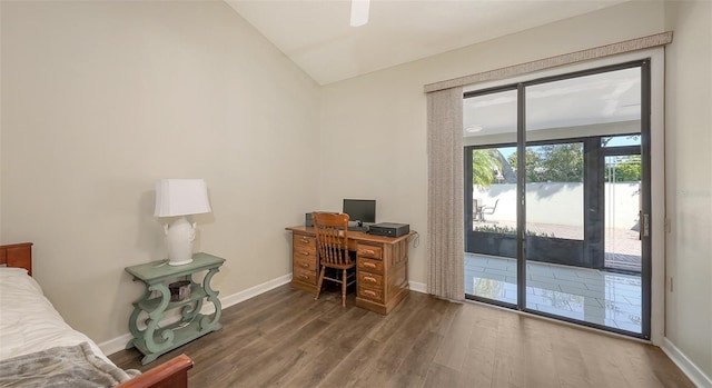 office area with vaulted ceiling, baseboards, and wood finished floors