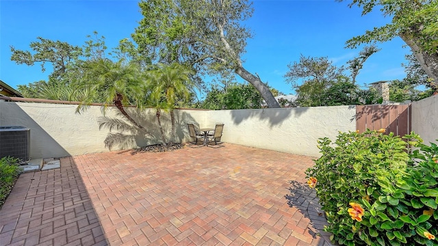 view of patio featuring central AC unit and a fenced backyard