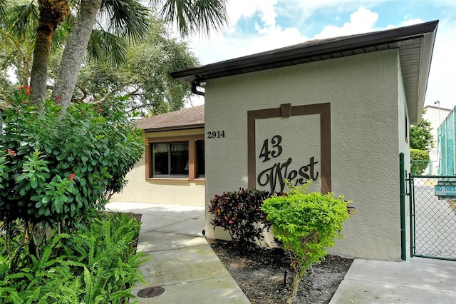 view of building exterior featuring fence