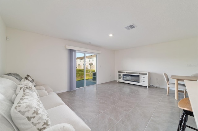 6677 SW 81st Loop, Ocala, FL 34476 - living area with light tile patterned floors, visible vents, baseboards, and recessed lighting