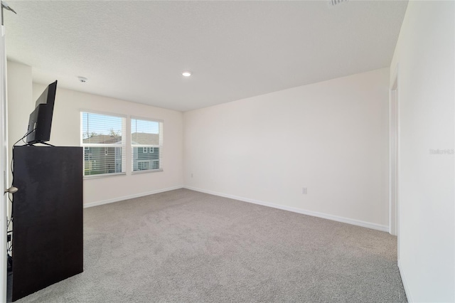 6677 SW 81st Loop, Ocala, FL 34476 - spare room with carpet flooring, recessed lighting, a textured ceiling, and baseboards