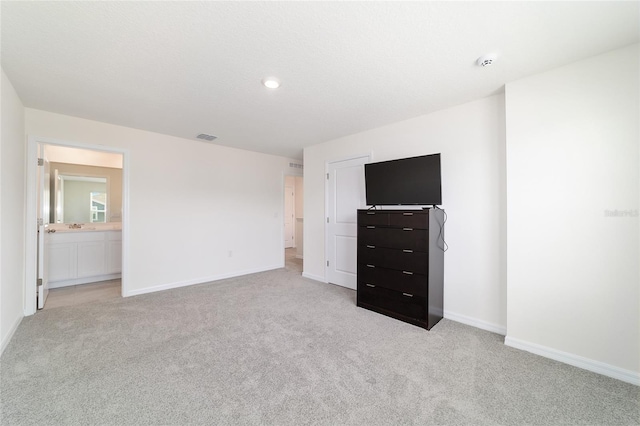 6677 SW 81st Loop, Ocala, FL 34476 - unfurnished bedroom with visible vents, light colored carpet, baseboards, and a sink