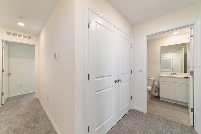 6677 SW 81st Loop, Ocala, FL 34476 - hall featuring visible vents, recessed lighting, light tile patterned flooring, baseboards, and light colored carpet