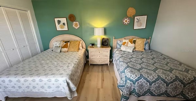 bedroom with a closet and wood finished floors