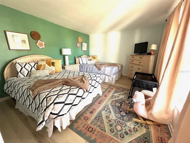 bedroom featuring wood finished floors