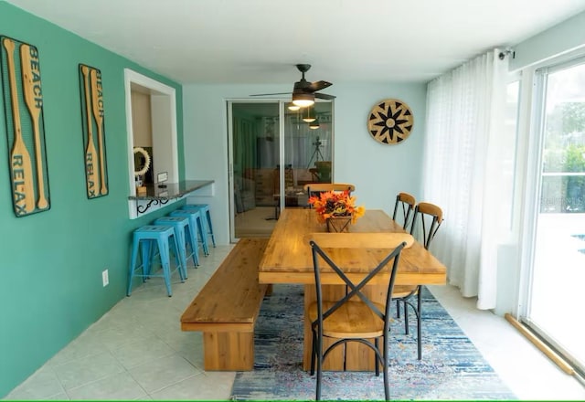 dining room featuring a ceiling fan and light tile patterned flooring