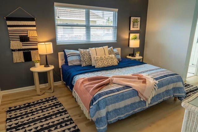 bedroom featuring baseboards