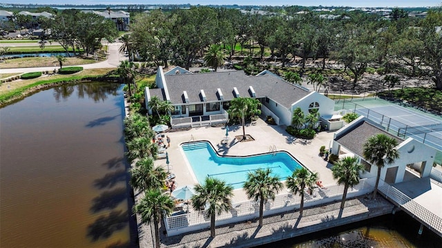 birds eye view of property with a water view