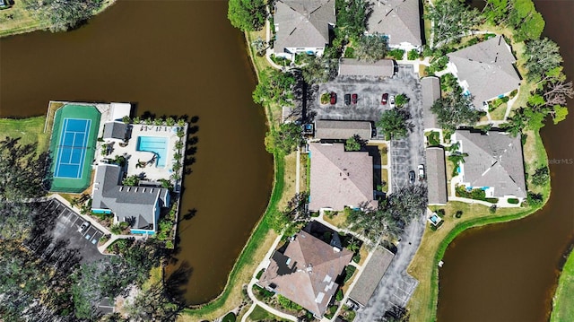 drone / aerial view featuring a water view and a residential view