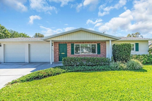 ranch-style home with a garage, concrete driveway, brick siding, and a front lawn