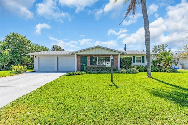 ranch-style house featuring a front lawn, concrete driveway, brick siding, and an attached garage