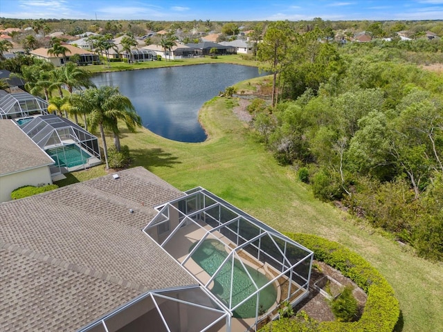 birds eye view of property featuring a water view and a residential view